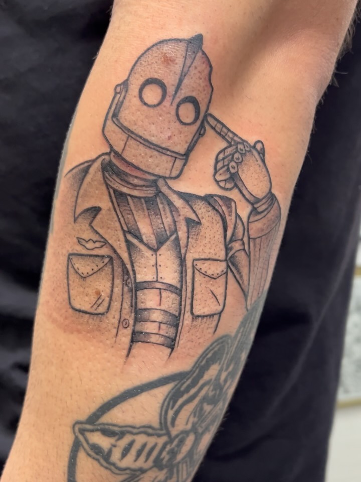 Iron Giant black and grey fine line tattoo