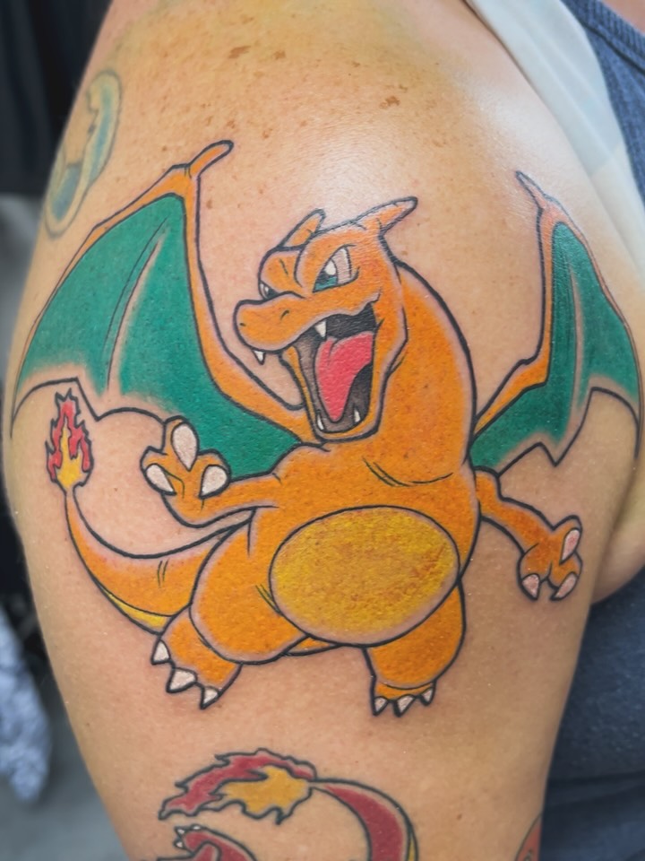 Vibrant color Charizard Pokemon tattoo