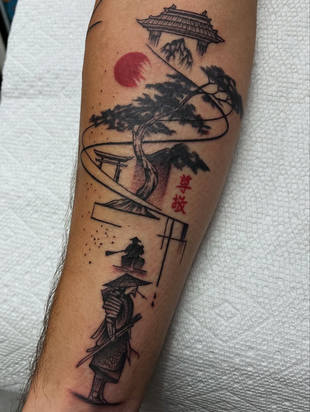Japanese samurai scene with pagoda and pine tree tattoo forearm