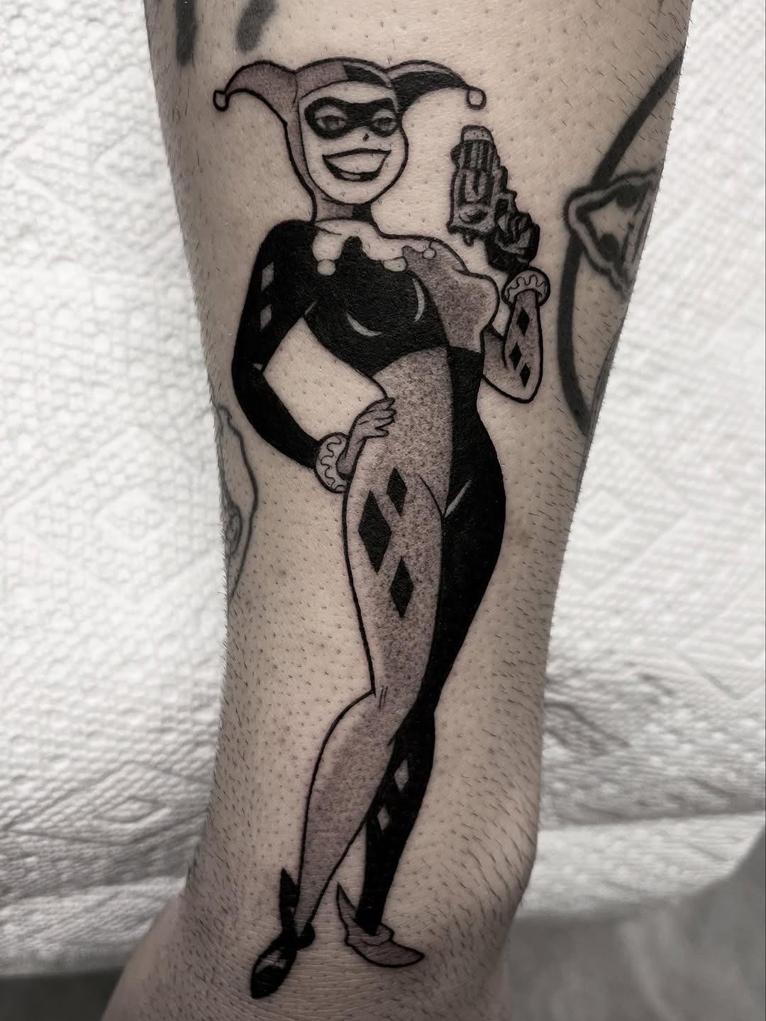 Bold black and grey Harley Quinn tattoo